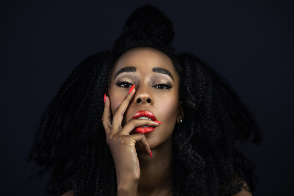 Curly Sensual Black Lady with Red Lipstick & Nails