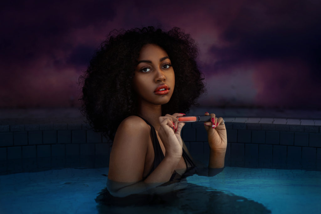 Curly Hair Sensual Shady Lady In The Pool Holding Lip Stick