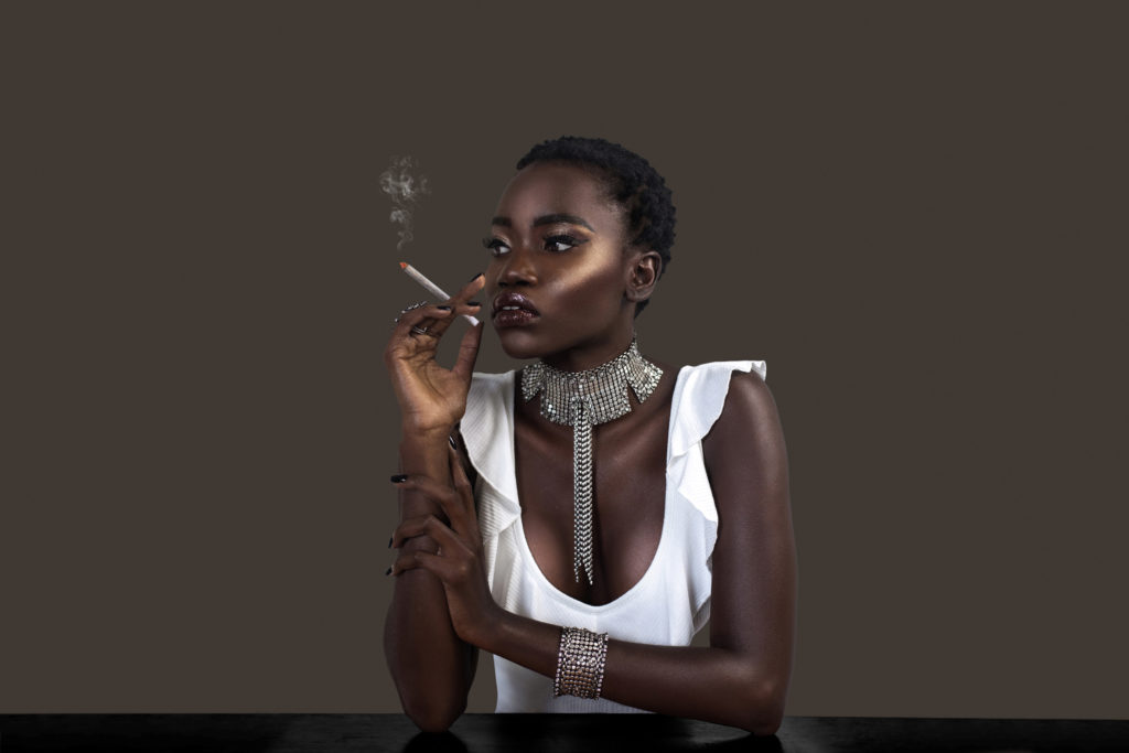 Joint Smoking Black Lady in Silver Jewelry