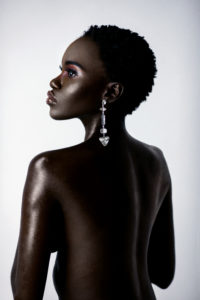 Clean & Serene Bare Back Black Lady With Diamond Earring