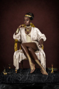 Female Egyptian Pharaoh Sitting On Gold Throne