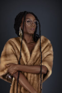 Serene Young Black Lady in Fur