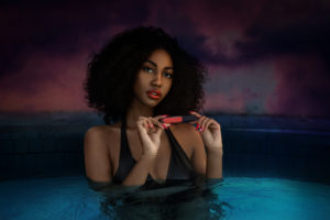 Curly Hair Flirtatious Shady Lady In The Pool Holding Lip Stick