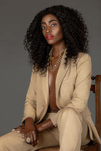 Sexy Black Woman in a Beige Suit