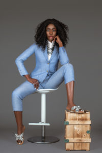 Sexy Black Woman in Blue Suit Sitting